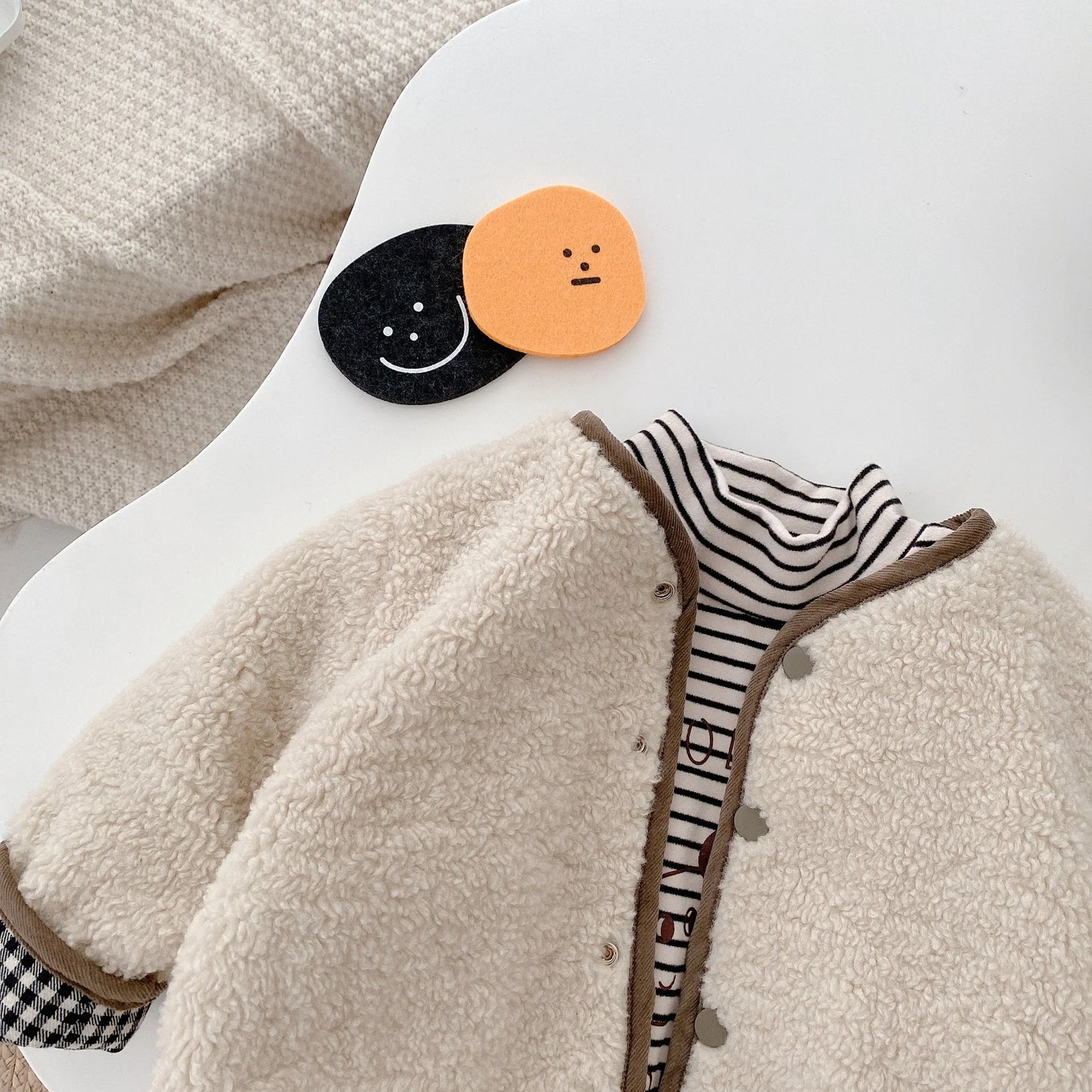 Veste plaid double face pour bébé