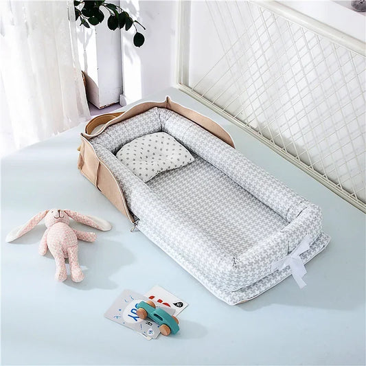 Réducteur de lit bébé pliable marron