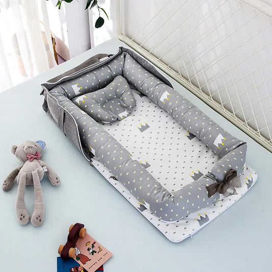 Réducteur de lit bébé pliable gris