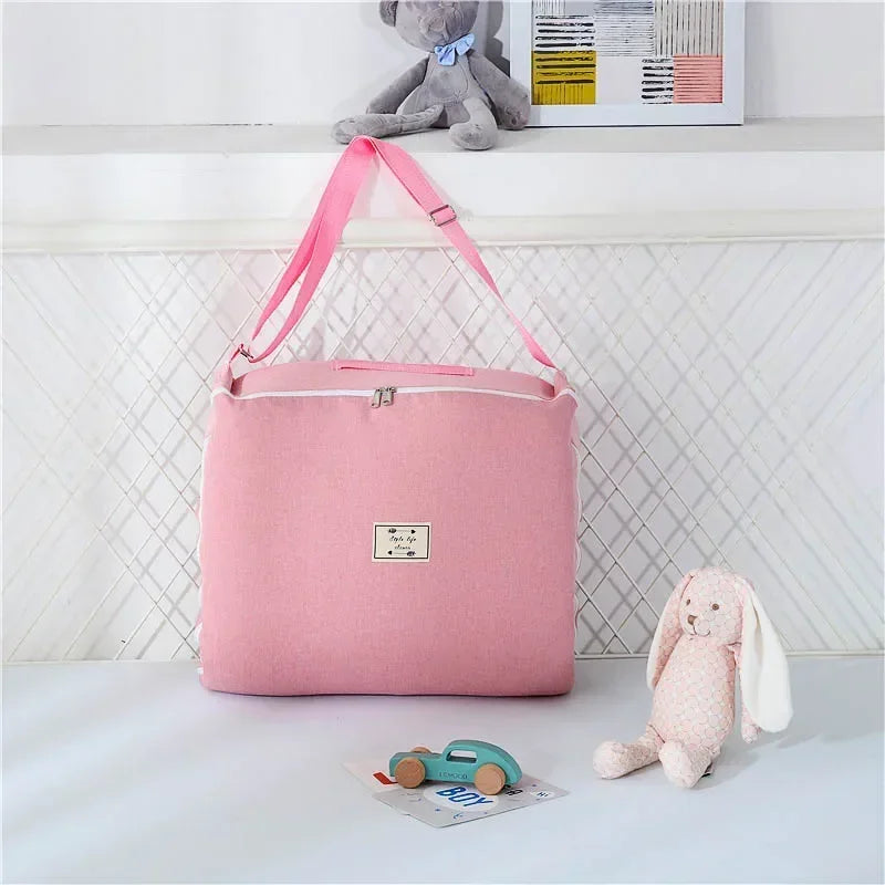 Réducteur de lit bébé rose à pois