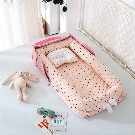 Réducteur de lit bébé rose à pois
