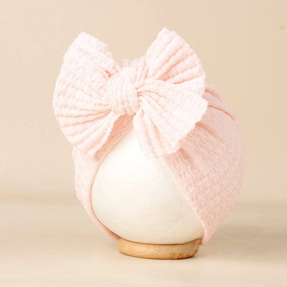 Turban en tricot avec noeud pour bébé
