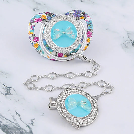 Sucette de luxe à motif papillon pour bébé