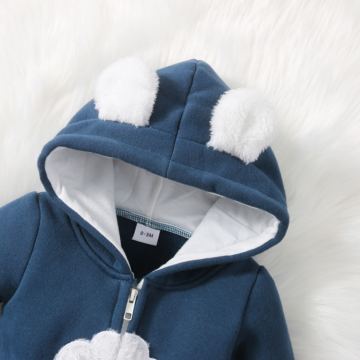 Grenouillère à capuche pour bébé
