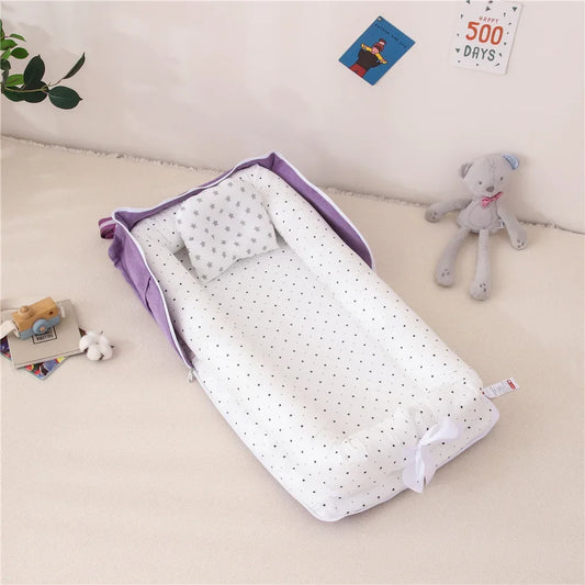 Réducteur de lit bébé pliable violet
