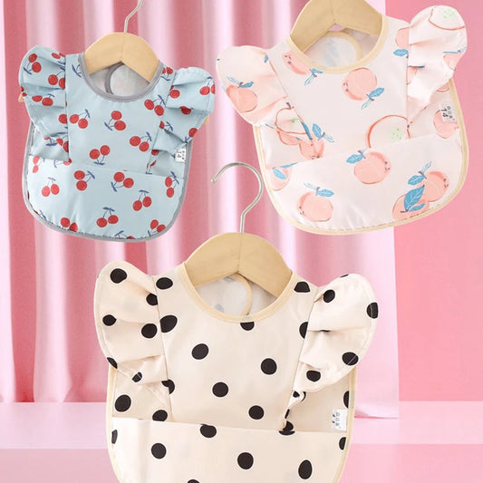 Bavoir imperméable avec ailes d’ange pour bébé