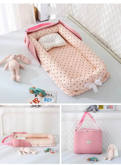 Réducteur de lit bébé rose à pois